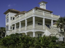 This beautiful oceanfront home sits directly on a golf course in Palm Coast, Florida.