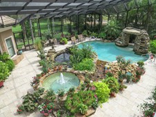 Pool with landscaping and waterfall - manor home - Ormond Beach FL