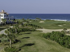 This oceanfront home in Palm Coast, Florida is surrounded by golf and water