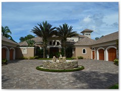 Mediterranean style custom home with courtyard